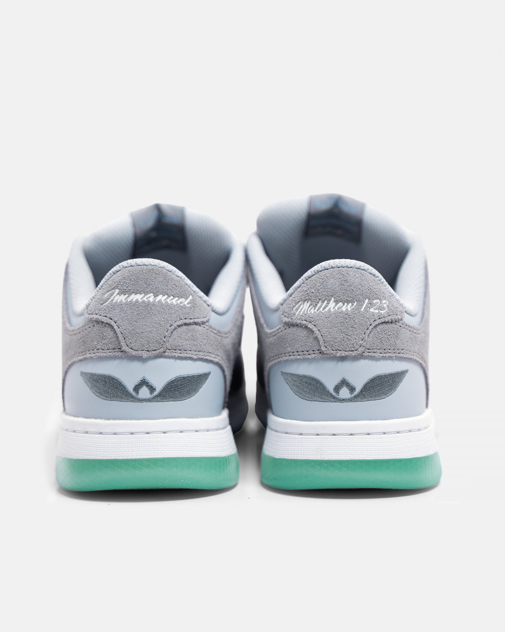 Rear view of gray Unitus Immanuel 1 sneakers with embroidered heel details.