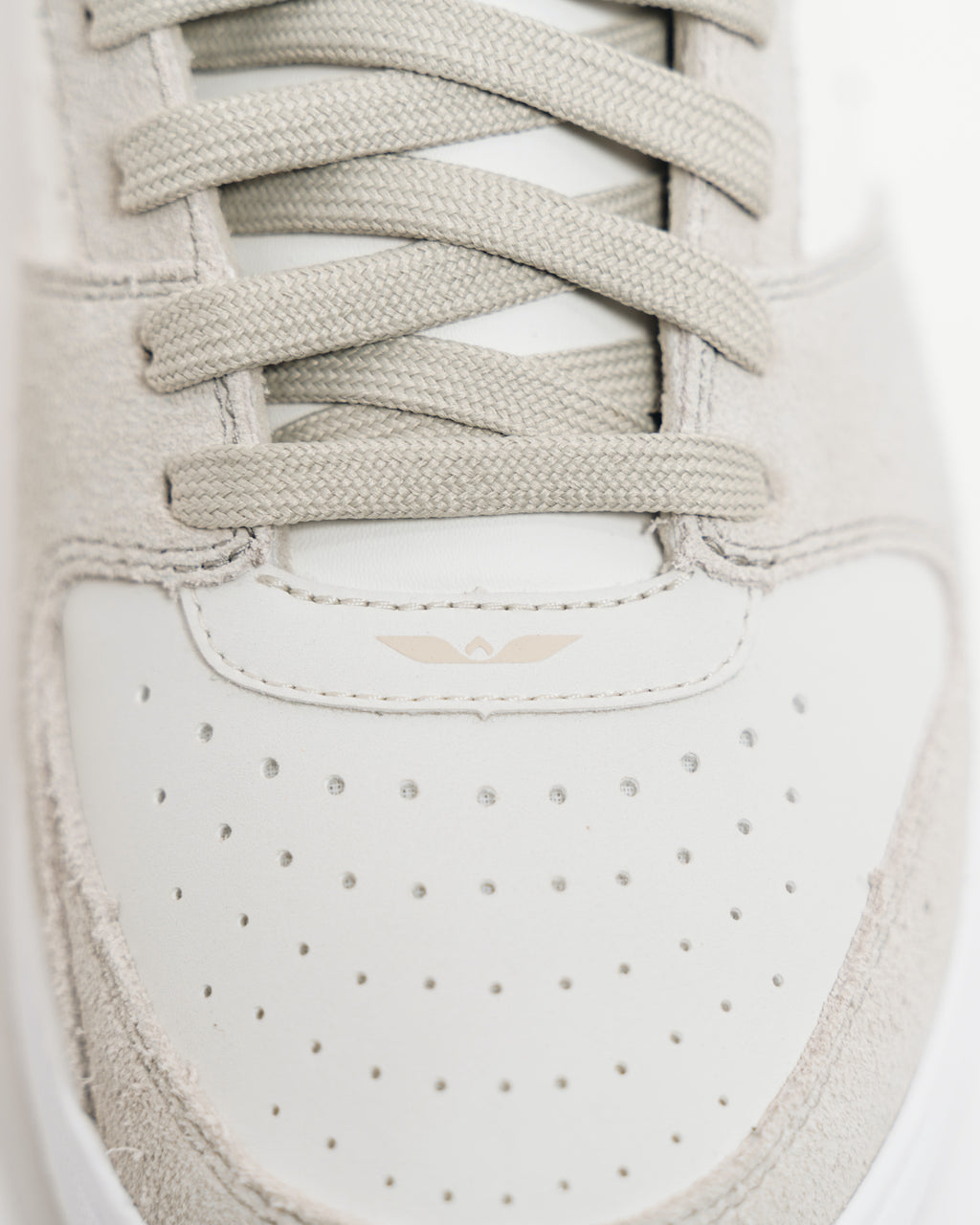 Top-down view of the Immanuel 1 Tan toe box, laces and wing logo