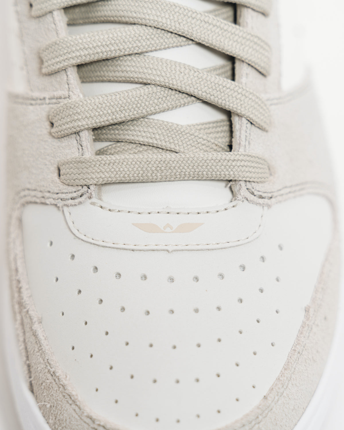 Top-down view of the Immanuel 1 Tan toe box, laces and wing logo
