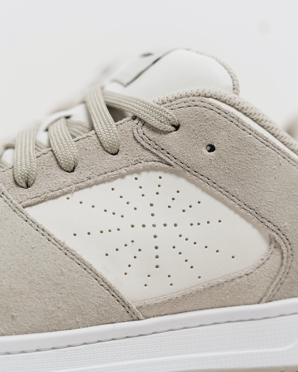 Close-up of the perforated cross on the outer side of the Immanuel 1 Tan