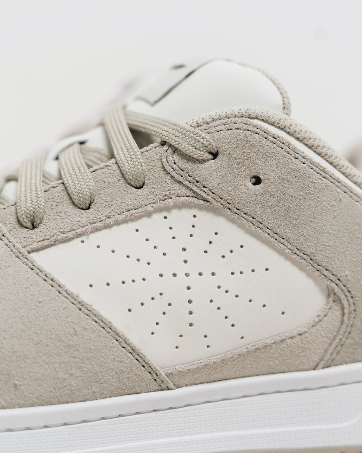 Close-up of the perforated cross on the outer side of the Immanuel 1 Tan